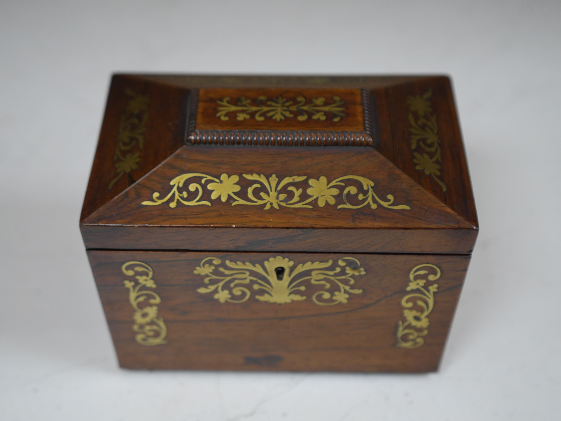 A Regency cut brass inlaid tea caddy, 15cm high. Condition - fair to good